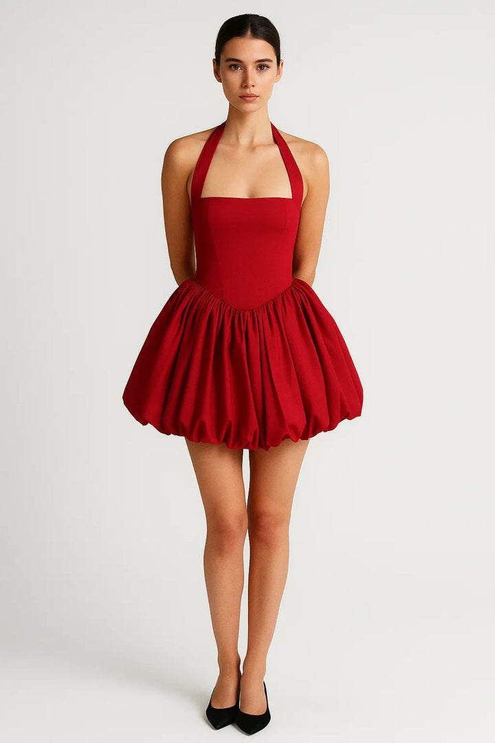 Women's elegant party dress: chic halterneck, short hem, and voluminous skirt for a stunning look.