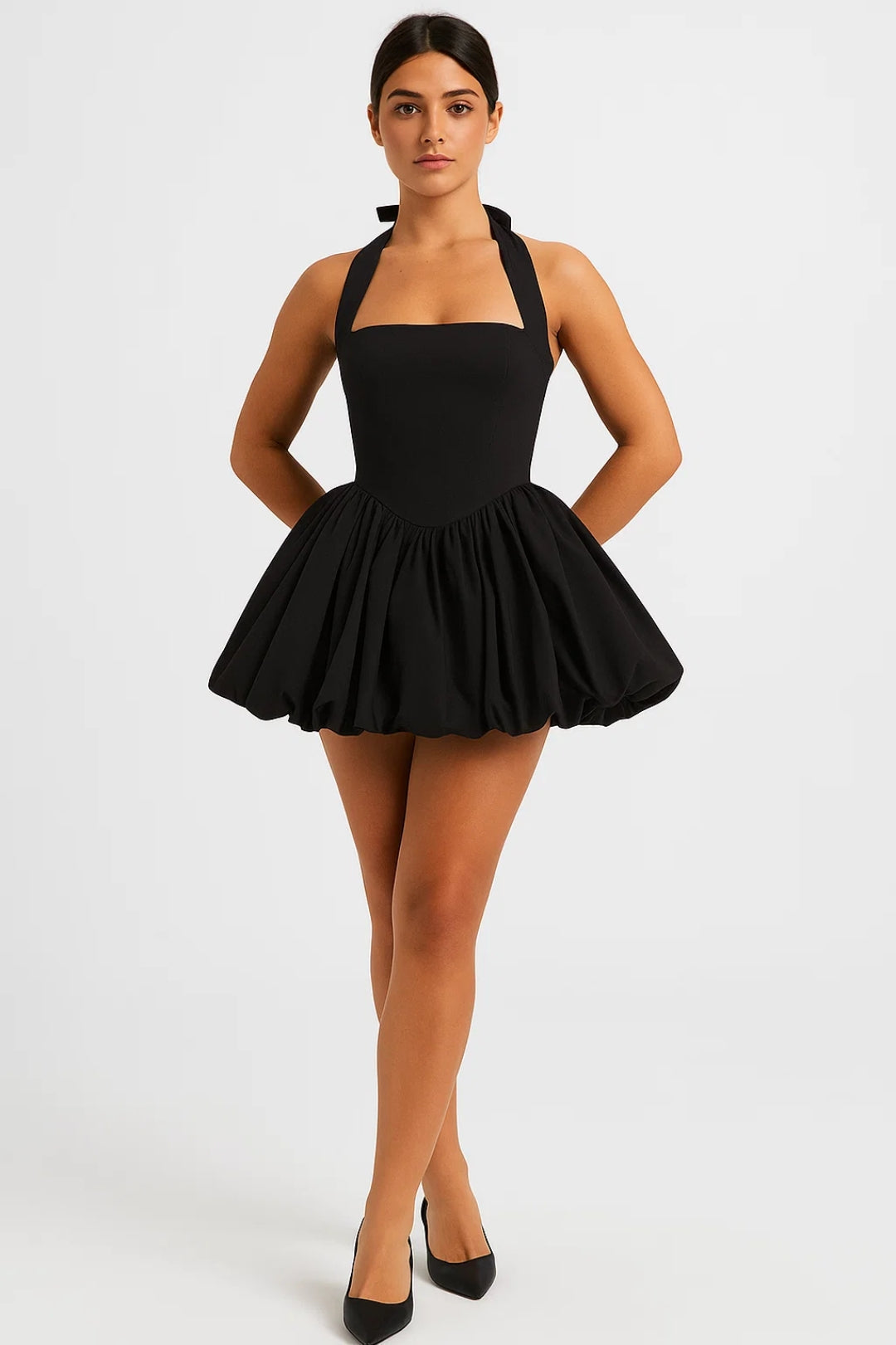 Summer-ready women's halterneck mini dress with a flirty voluminous skirt and chic design.