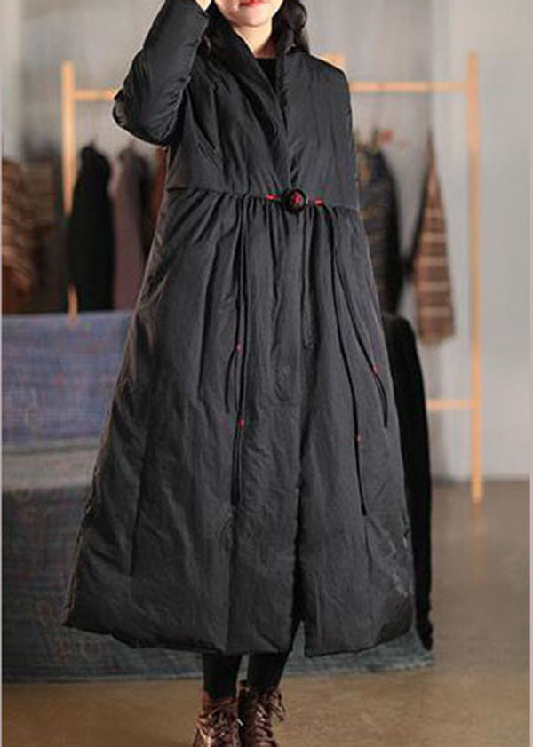 Stylish women's oversized winter coat, loose fit with a high collar and button detailing for chic outerwear.