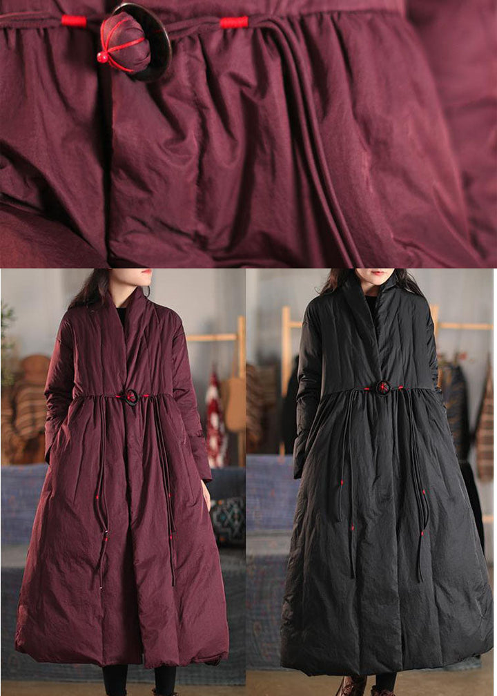 Elegant women's high collar winter coat with chic button-front closure, perfect for stylish cold weather outfits.