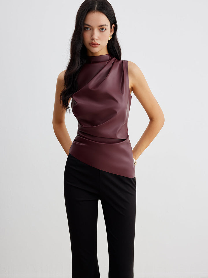 Sleeveless high neck women's top with elegant drape. Versatile for formal or casual chic outfits.