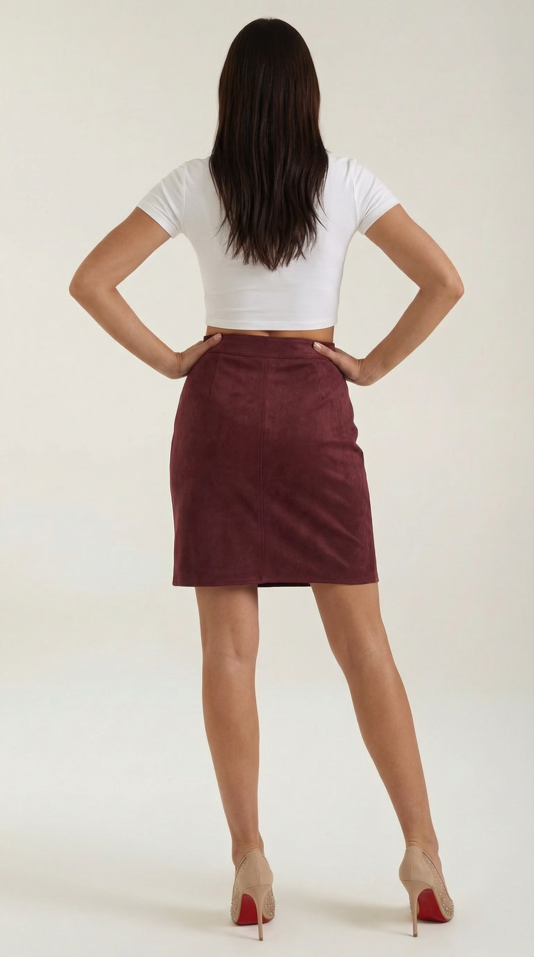 Women's high-waisted mini skirt with sophisticated button accents, chic style.