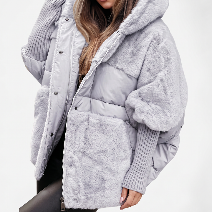 Cozy women's hooded winter jacket, ideal for daily wear. Stylish outerwear offering warmth & comfort in cold weather.
