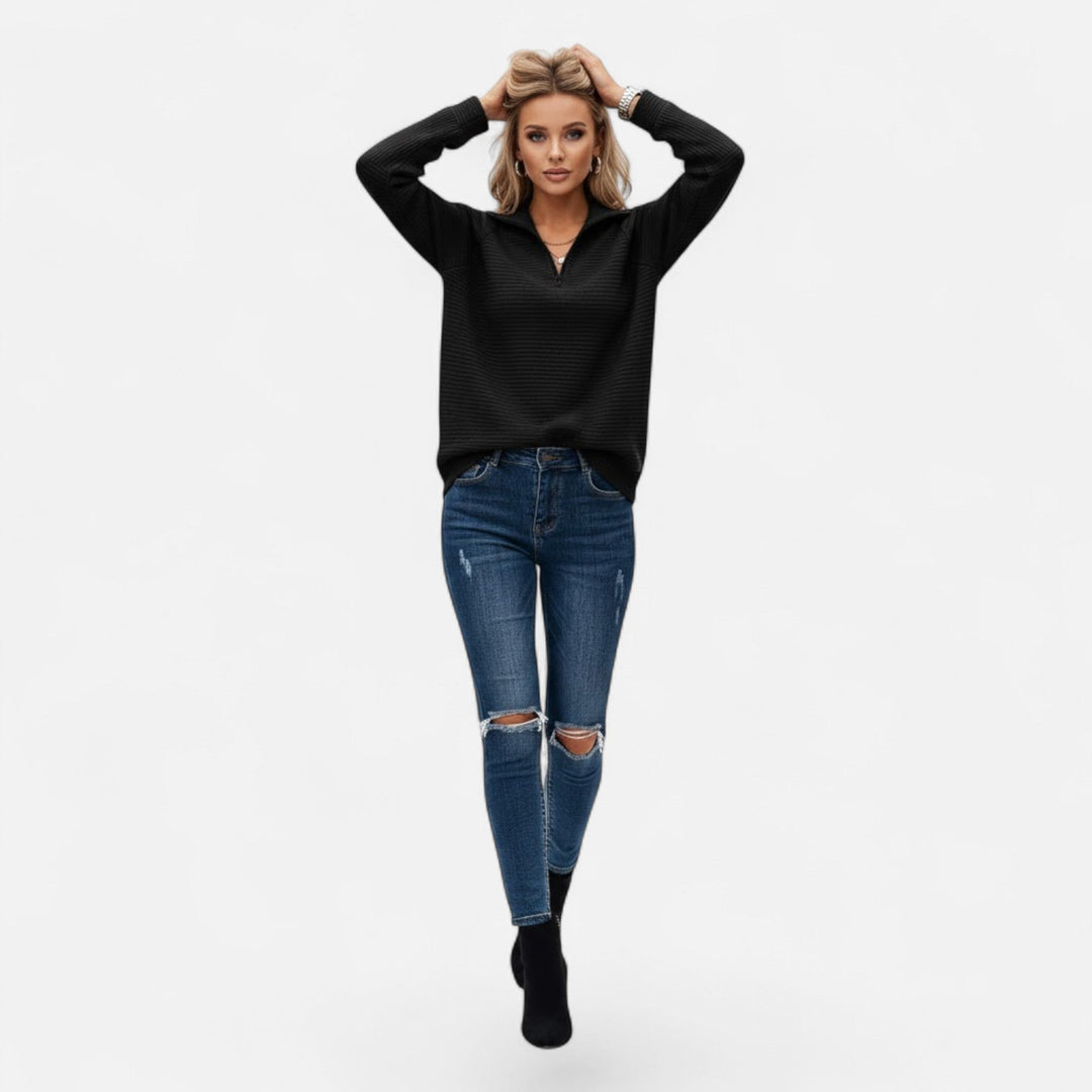Modern women's knit sweater featuring a stand-collar zipper, long sleeve, for casual elegance.