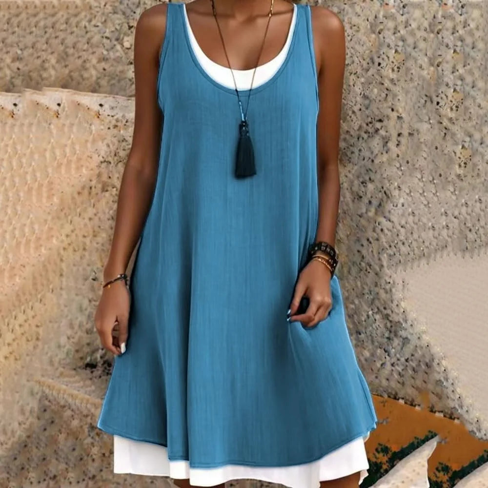 Stylish women's sleeveless layered mini dress with a scoop neck, a versatile and trendy summer fashion choice.