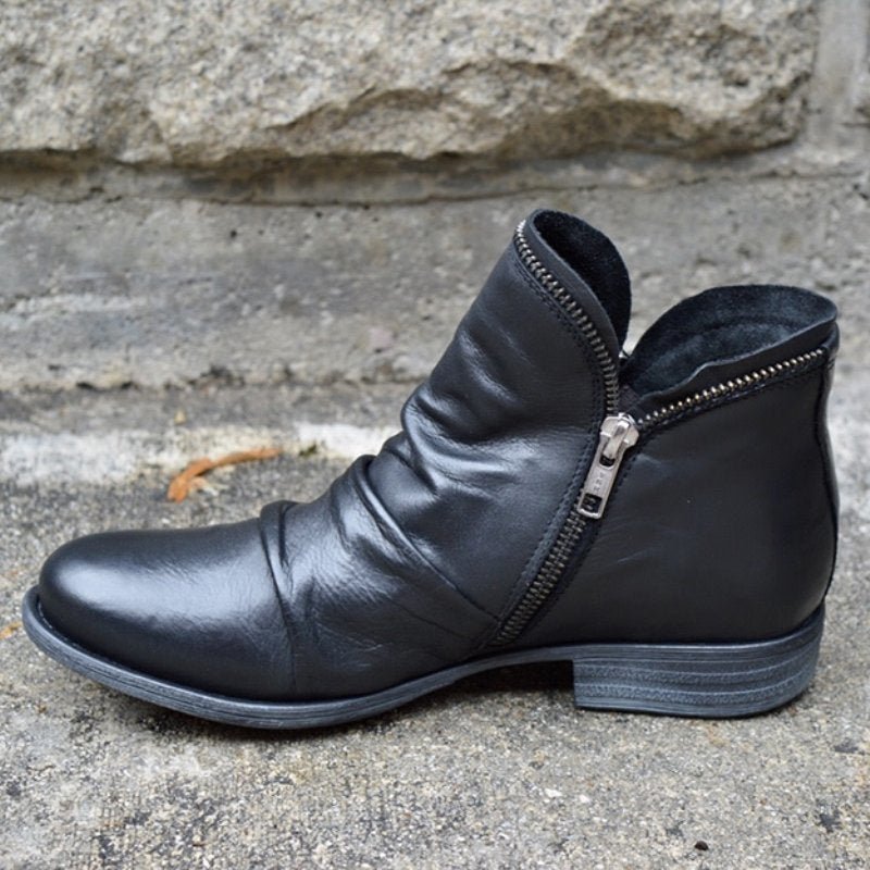 Chic women's leather ankle boots with side-zip closure & ruched detail. Stylish low heel for versatile everyday wear.