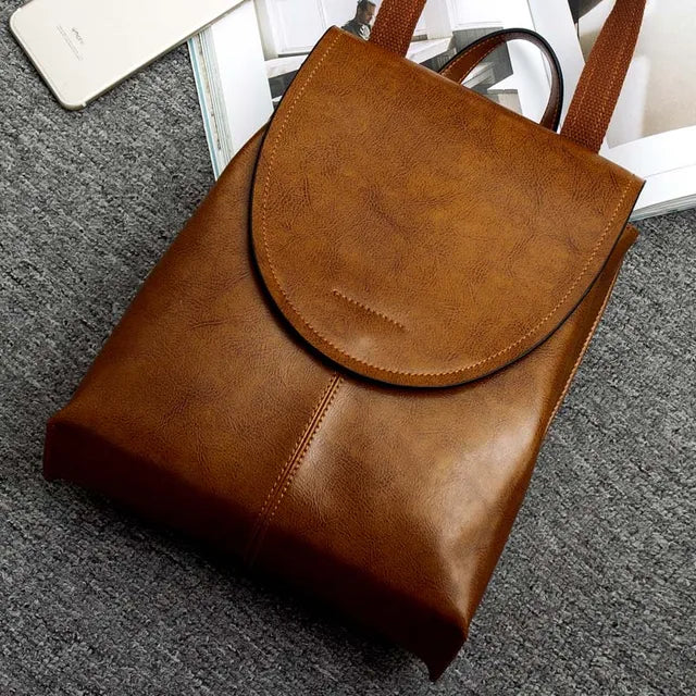 Fashionable women's leather backpack, ideal work bag or daily accessory. Chic & practical shoulder bag.