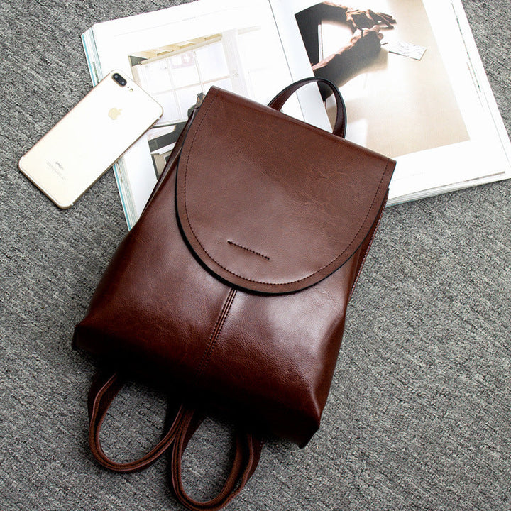 Functional women's leather travel bag, a versatile backpack for urban exploration & daily adventures.
