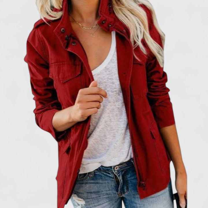 Chic women's long zippered jacket with practical pockets, perfect for smart casual or everyday fall fashion.