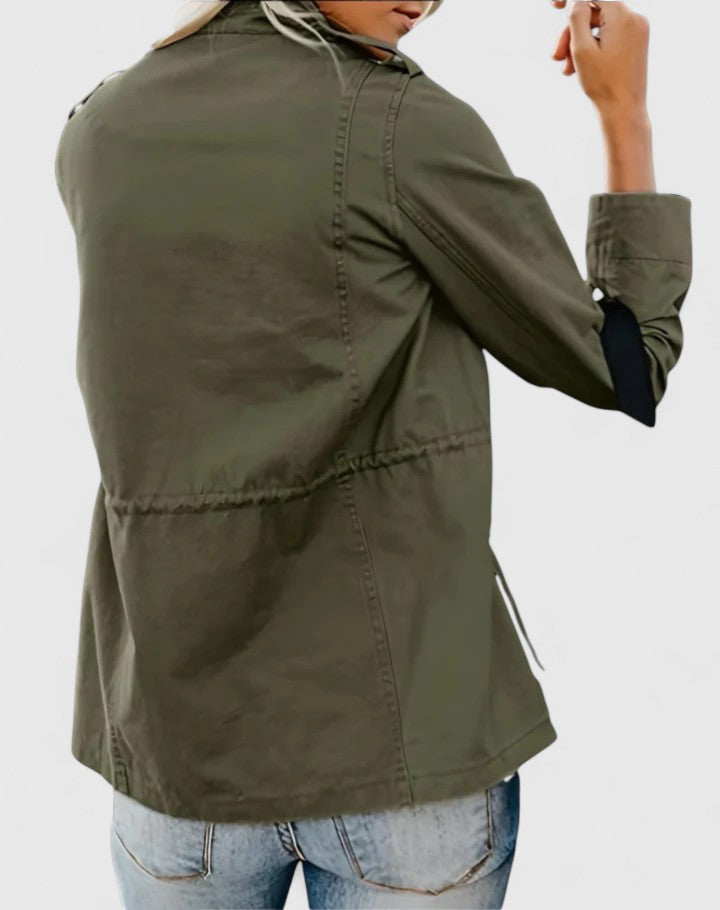 Durable women's collared long outerwear jacket, zippered and pocketed for a practical yet stylish winter look.