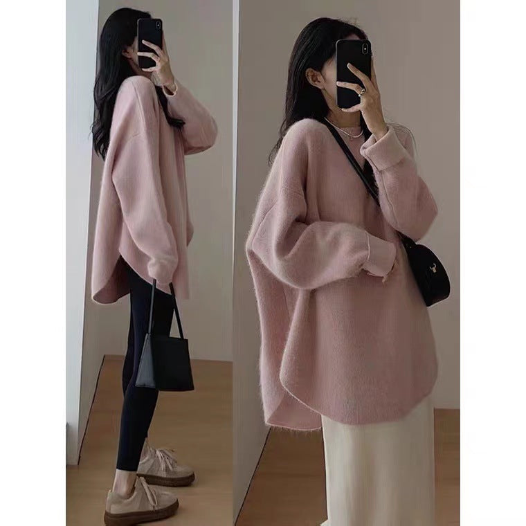Stylish women's mid-length sweater for chic autumn and winter fashion. Elegant and comfortable pullover.