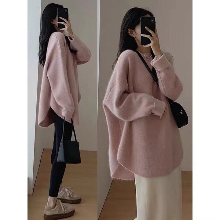 Stylish women's mid-length sweater for chic autumn and winter fashion. Elegant and comfortable pullover.