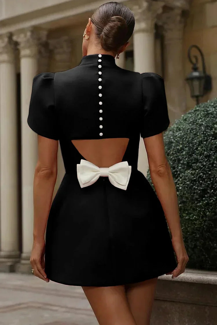 Spring/summer women's mini dress, chic fashion with an elegant back bow. Perfect casual or refined versatile look.