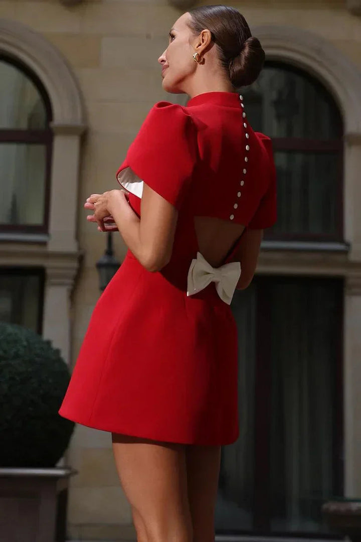 Fabric detail of chic women's mini dress, soft & refined. Elegant back bow accent. Perfect for casual or dressy style.