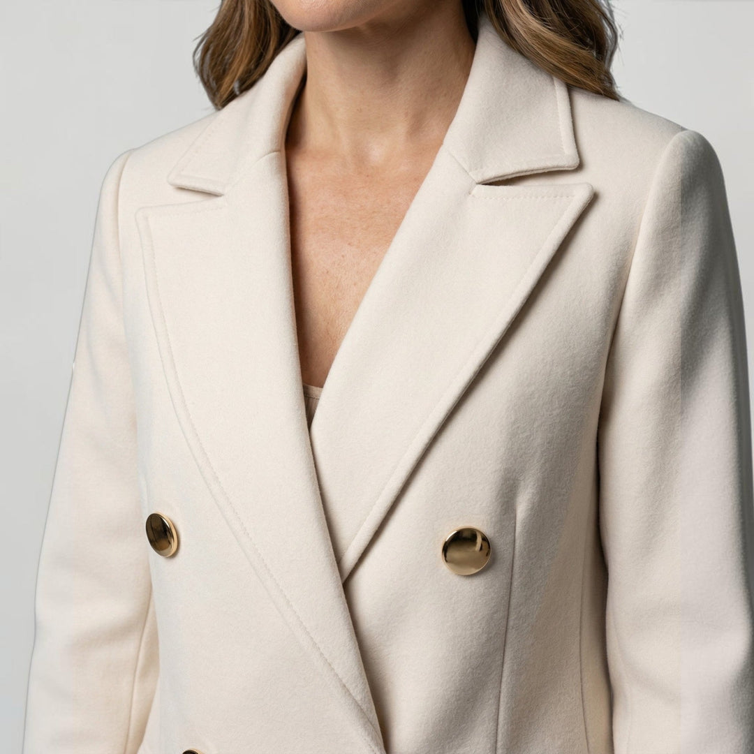 Sophisticated women's double-breasted jacket, ideal for a refined minimalist style and layering.