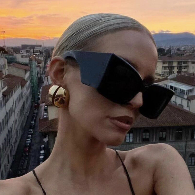 Stylish women's oversized cat-eye sunglasses. UV protected eyewear with a modern plastic frame, perfect accessory.