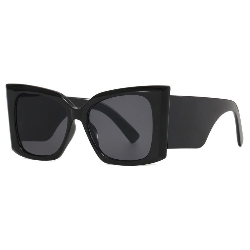 Women's oversized cat-eye sunglasses, UV protected. Fashionable and functional eyewear, chic plastic frame.