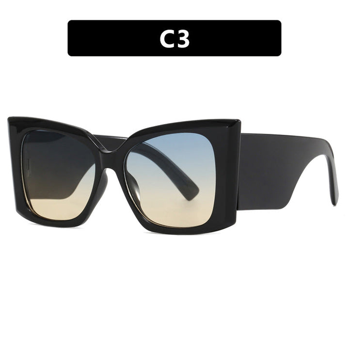Durable plastic frame women's oversized cat-eye sunglasses. Chic design, UV protected fashion eyewear accessory.
