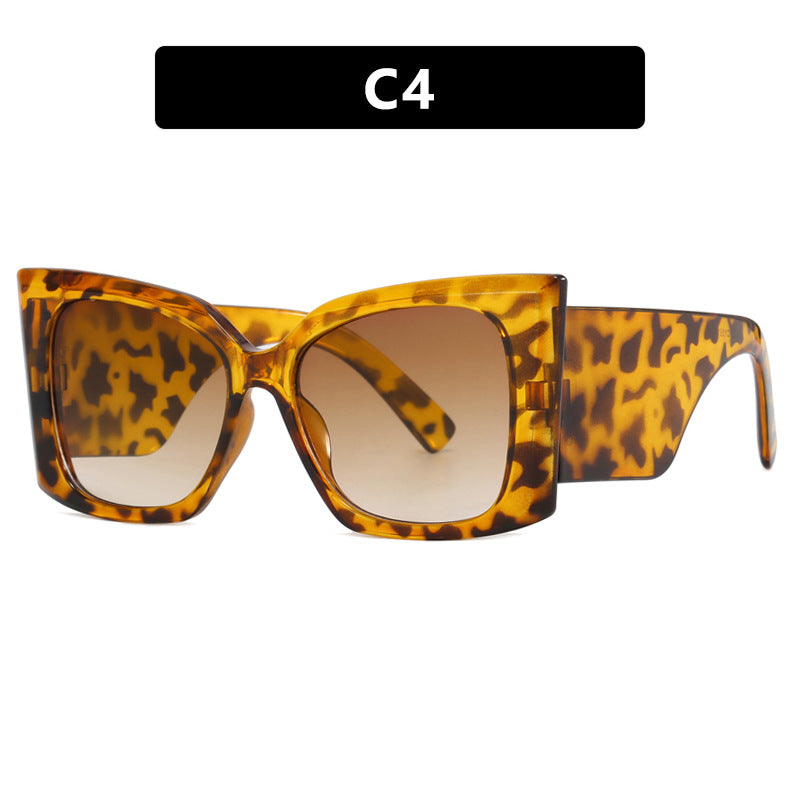 Elegant women's oversized cat-eye sunglasses. Perfect fashion accessory, offers UV protection & stylish look.