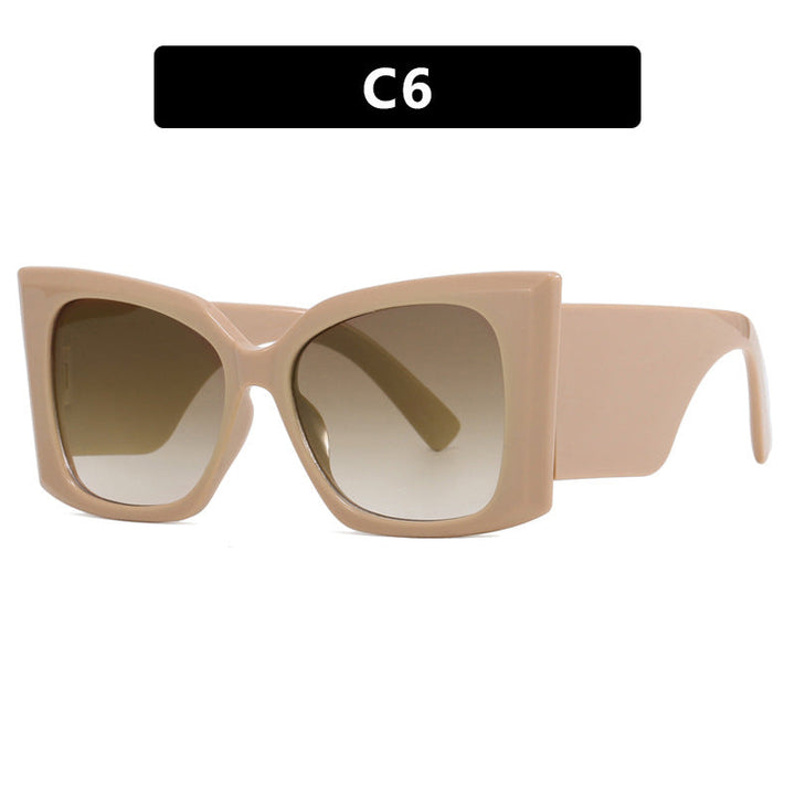Close-up of chic women's oversized cat-eye sunglasses. Plastic frame eyewear provides UV protection & style.