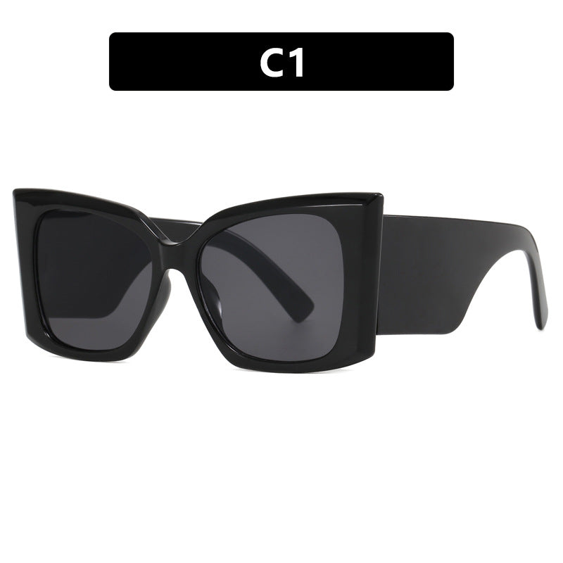 Fashionable women's oversized cat-eye sunglasses. Modern design, UV protection, a stylish plastic frame accessory.