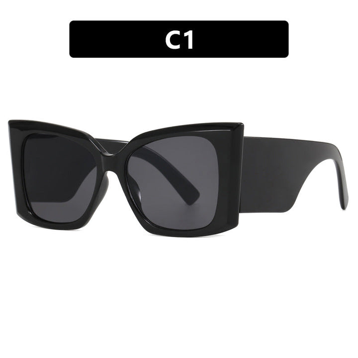 Fashionable women's oversized cat-eye sunglasses. Modern design, UV protection, a stylish plastic frame accessory.