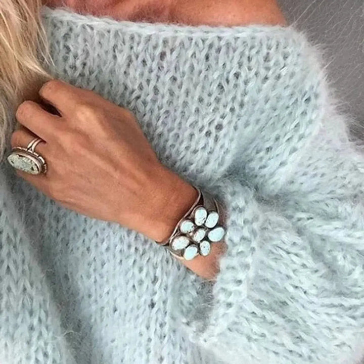 Modern women's oversized mohair blend jumper. A comfortable long sleeve sweater for chic, effortless winter style.