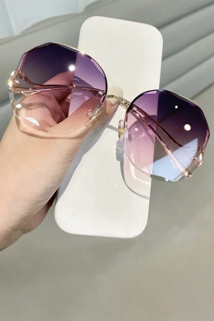 Versatile oversized rimless gradient sunglasses for women, a must-have modern eyewear piece.