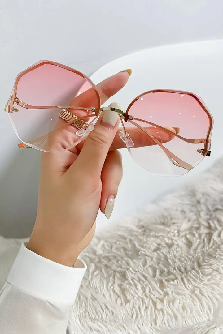 Fashionable oversized rimless gradient sunglasses for women, a stylish eyewear accessory for any outfit.