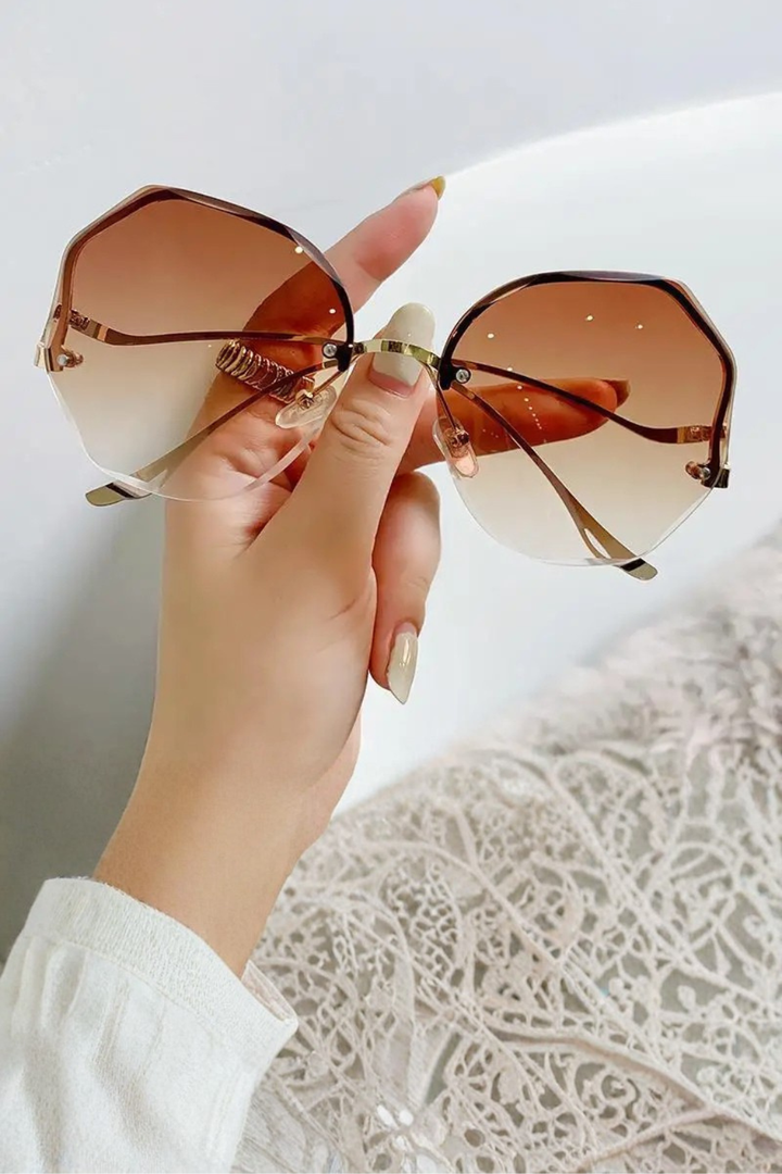 Luxury oversized rimless gradient sunglasses, a women's fashion accessory offering chic sun protection.