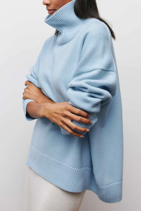 Cozy women's oversized turtleneck pullover sweater, offering ultimate comfort for fall & winter layering.
