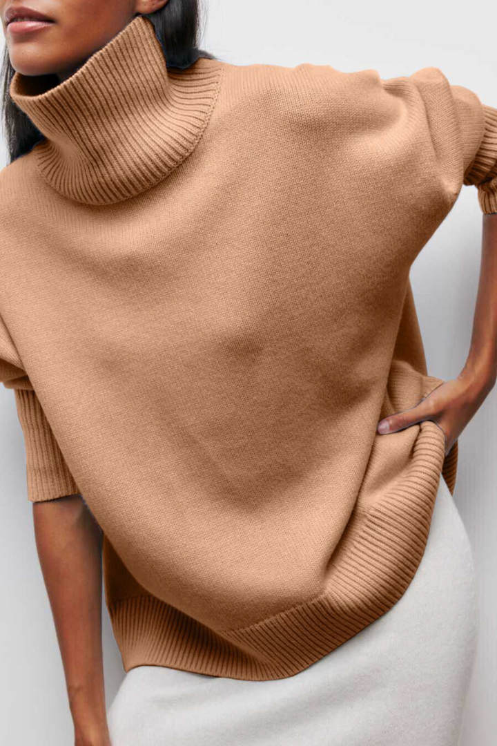 Soft women's oversized turtleneck sweater, a warm pullover for cozy winter fashion and everyday comfort.