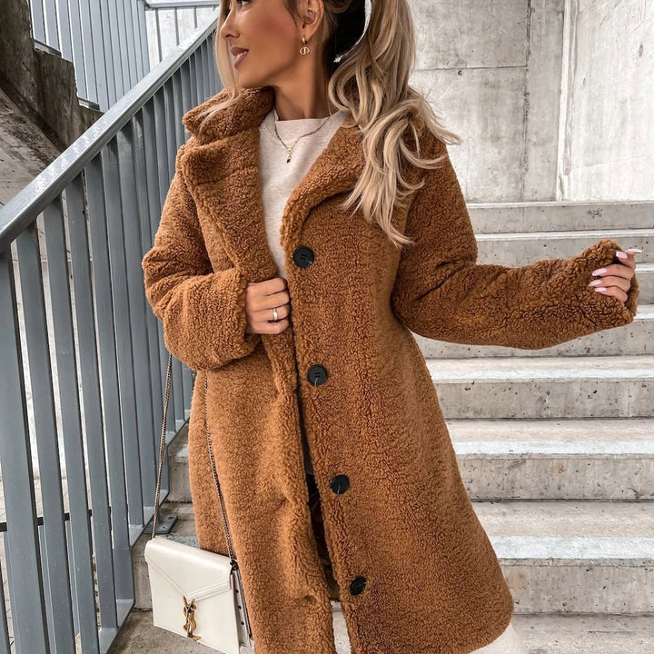 Cozy women's oversized long plush coat, a stylish and warm winter outerwear piece for chic cold weather layering.