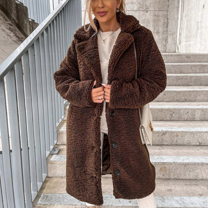 Warm women's oversized long plush coat, ideal button-front winter outerwear for cozy and chic cold weather fashion.