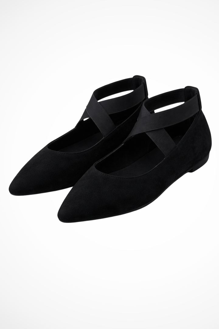 Stylish women's pointed toe flats featuring an adjustable ankle strap, great for work or casual outfits.