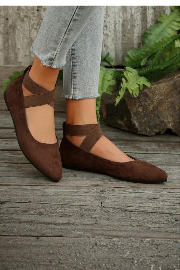Elegant women's pointed toe ballet flats with a comfortable ankle strap, enhancing any casual outfit.