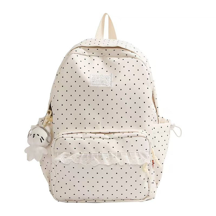 Chic women's polka dot ruffled backpack from oxford cloth, perfect as a fashion or school bag.