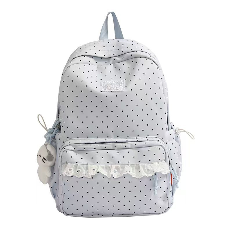 Cute ruffled polka dot women's backpack, ideal as a travel bag or for daily essentials, functional.