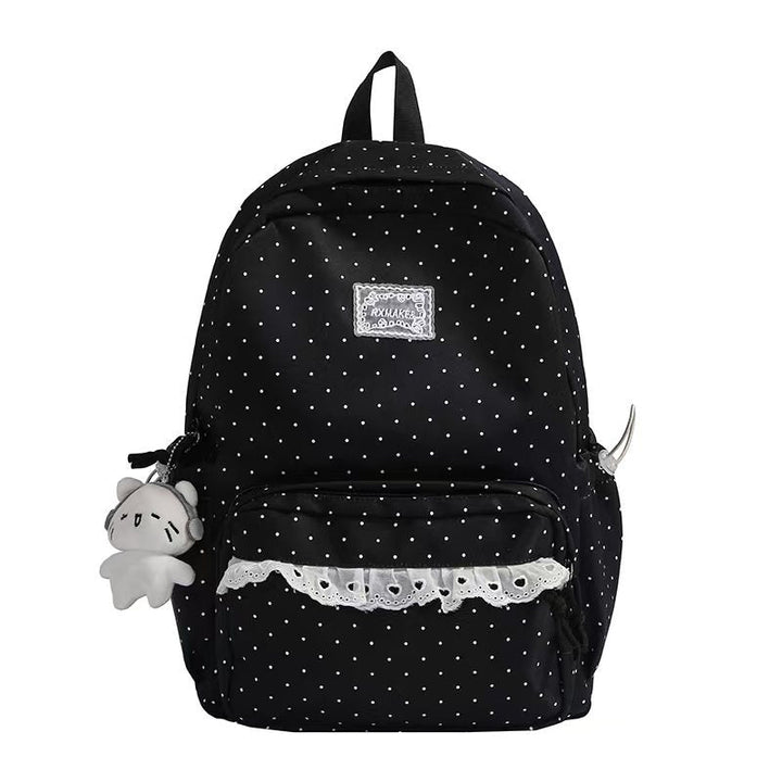 Oxford cloth women's polka dot ruffled backpack, a versatile and chic fashion bag for school or travel.