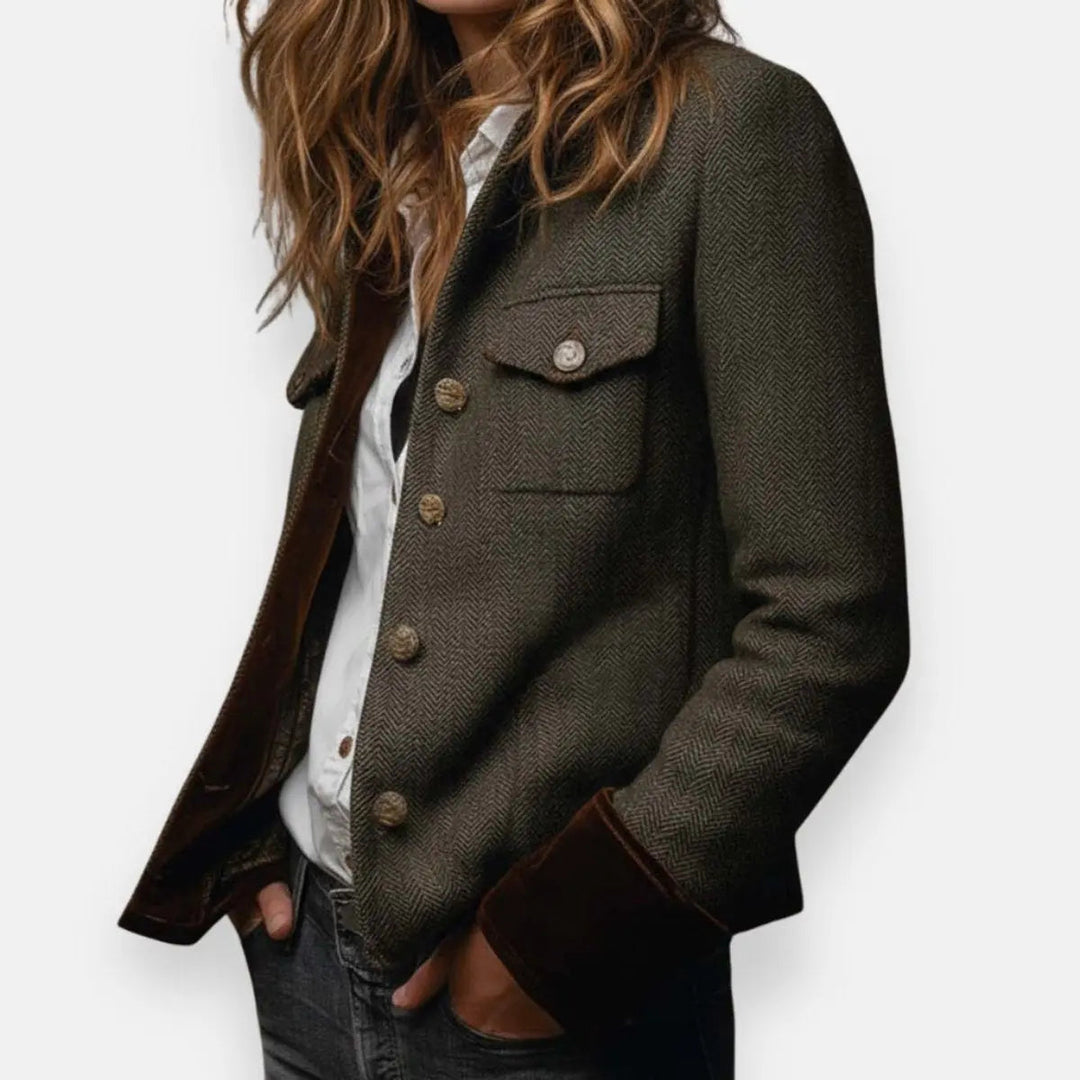 Close-up of a women's chic quilted jacket. Notice the intricate quilting pattern and shiny gold buttons for a refined look.