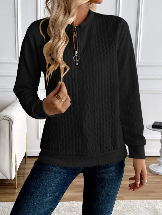 Fashionable women's quilted zip-up sweater, a versatile piece for casual wear.