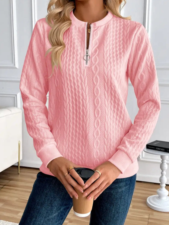 Stay warm and stylish in this women's quilted zip-up sweater, perfect for any season.
