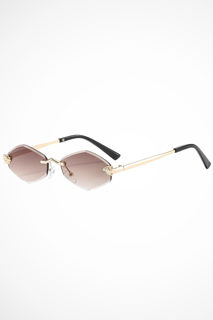 Women's stylish rimless cat eye sunglasses featuring delicate floral detail. Perfect chic ladies' eyewear.