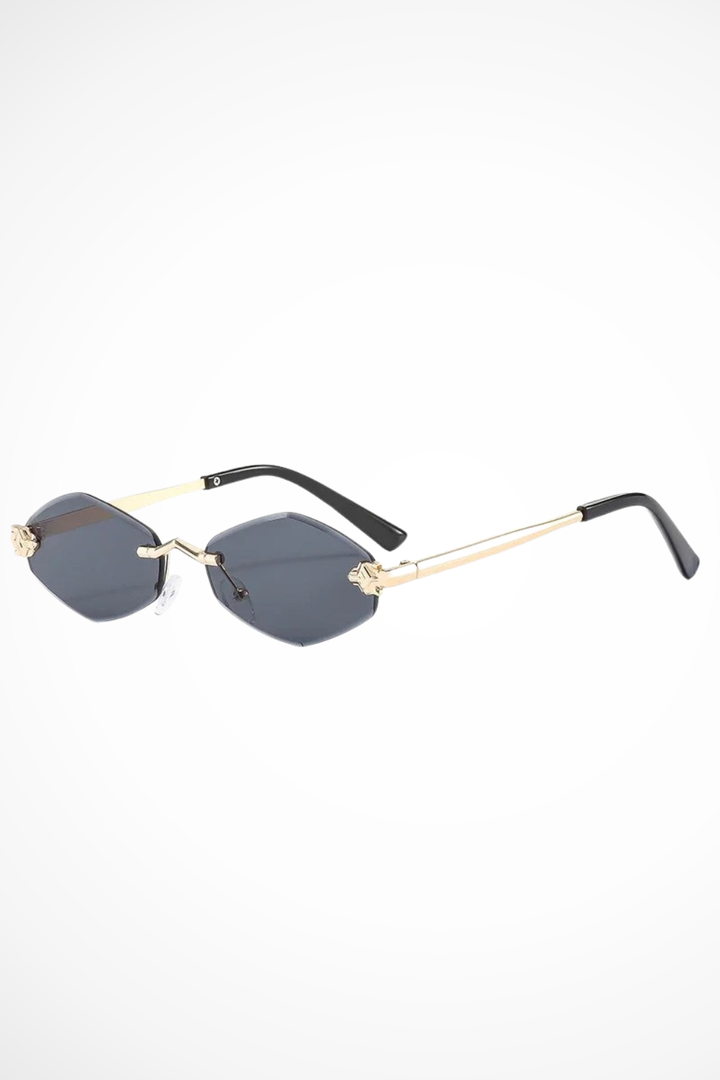 Glamorous rimless cat eye sunglasses for women, featuring unique floral details on the temples for a chic look.