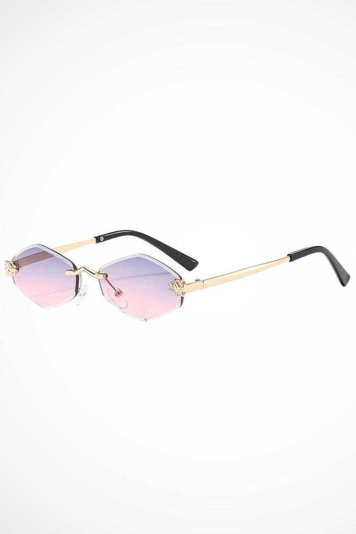 Fashionable women's rimless cat eye sunglasses with stylish floral details, perfect ladies' summer accessories.