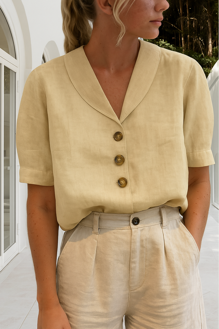 Elegant women's shawl collar blouse, short sleeve button-front top for office wear or smart casual occasions.
