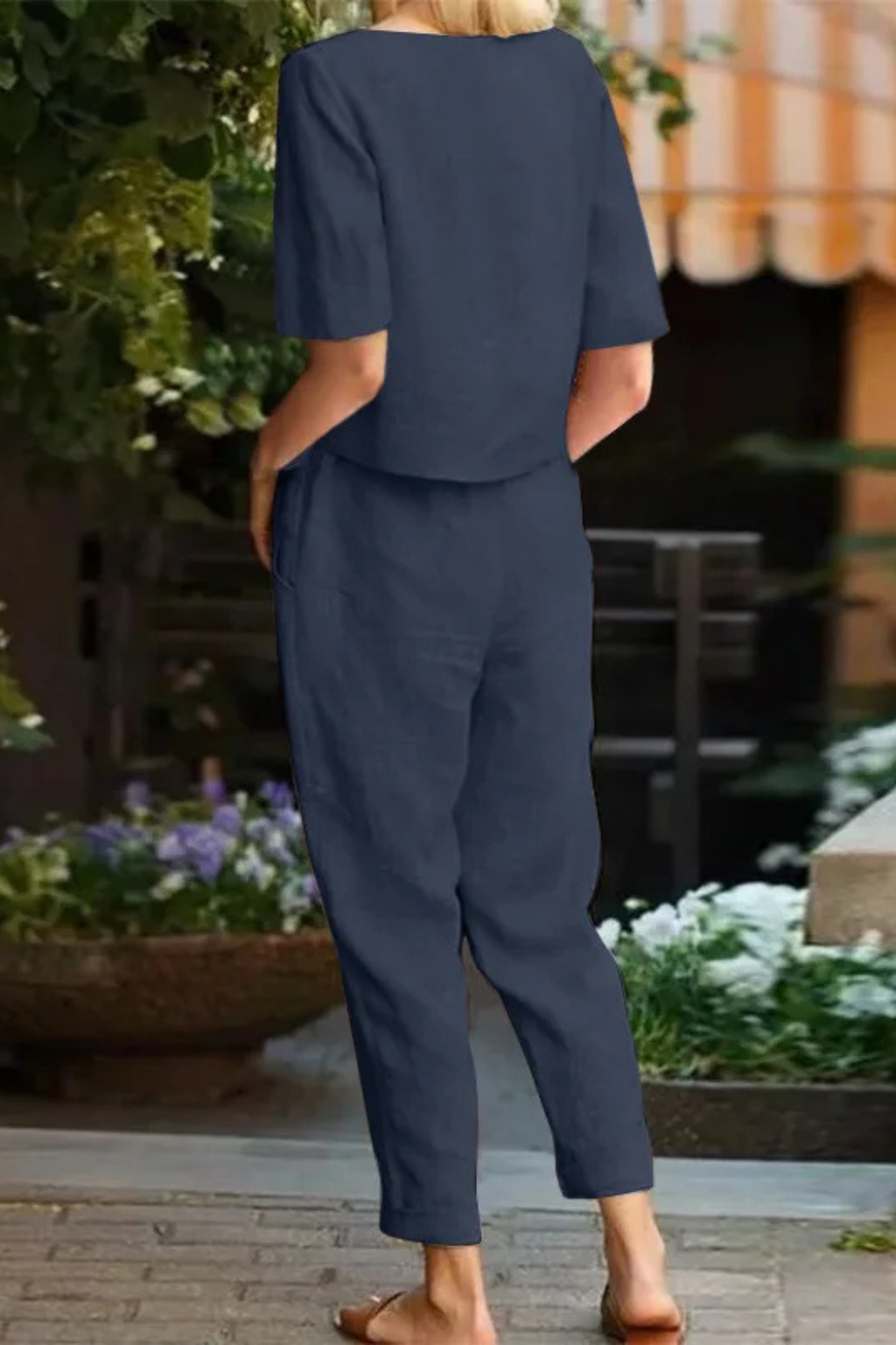 Women's casual resort wear: a comfortable short sleeve crop top & tapered trousers two-piece set, ideal for summer.
