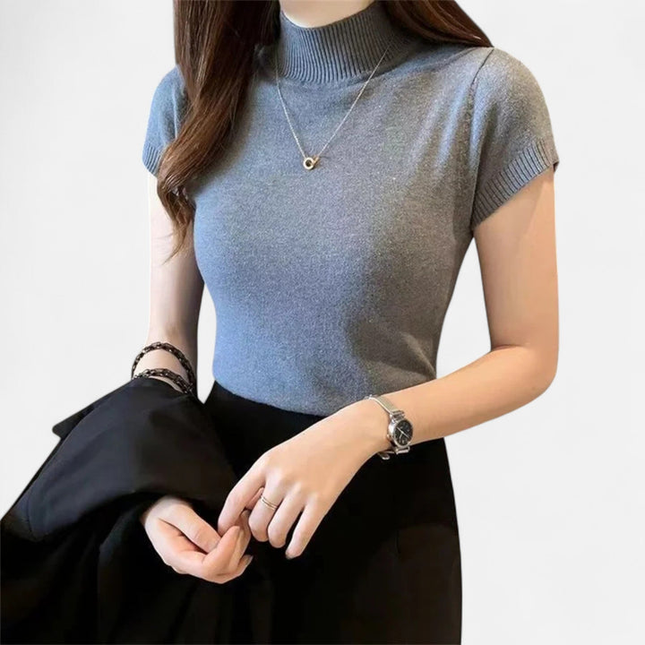 Fashionable short-sleeve turtleneck top for women, perfect for creating a sophisticated smart casual outfit.