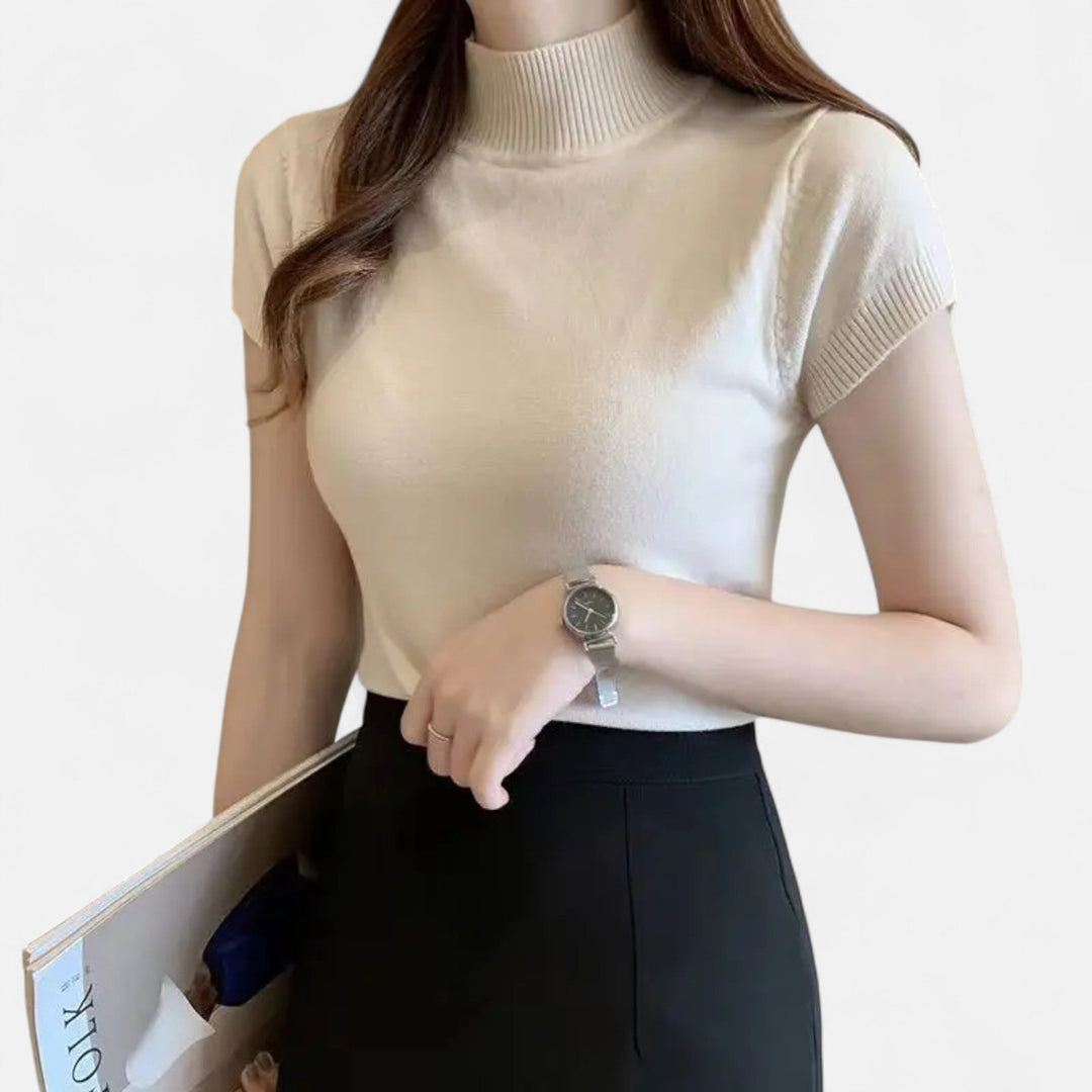 Modern women's short-sleeve turtleneck blouse, an essential addition to any smart and chic wardrobe.