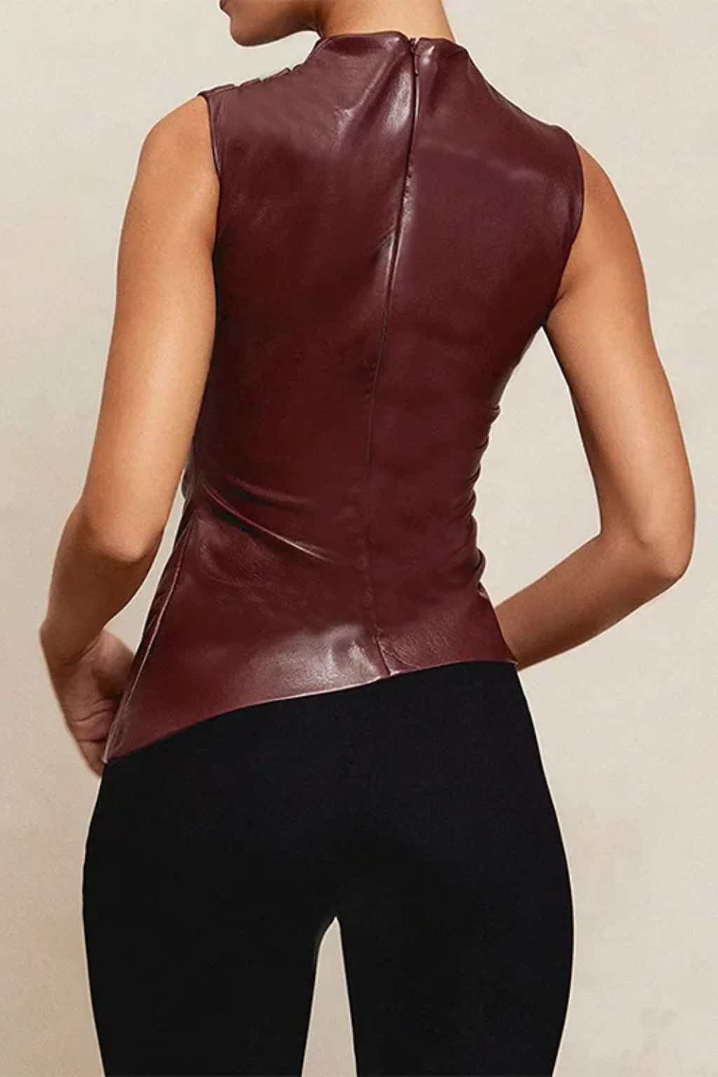 Sophisticated women's black sleeveless high neck top. Chic summer wear, perfect for elegant and modern fashion styles.